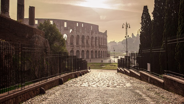 Colosseum at Sunrise – View from Ancient Roman Street